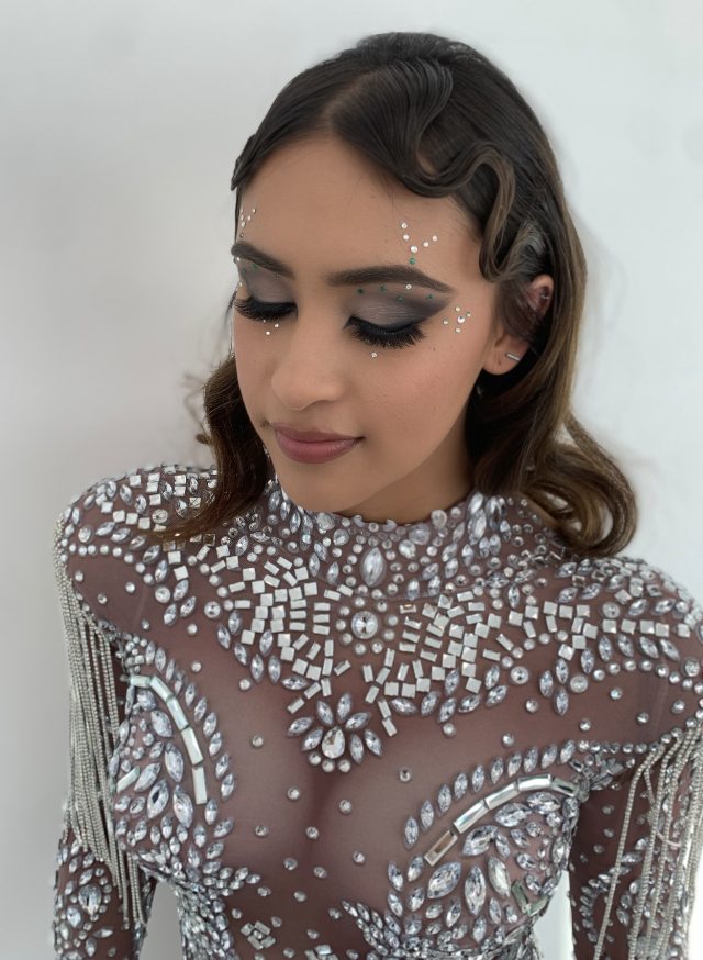 Rhinestone bodysuit editorial glam with face gems
