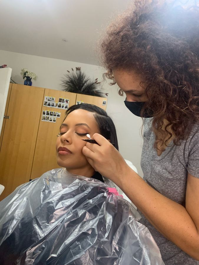 Applying eyeliner in the studio