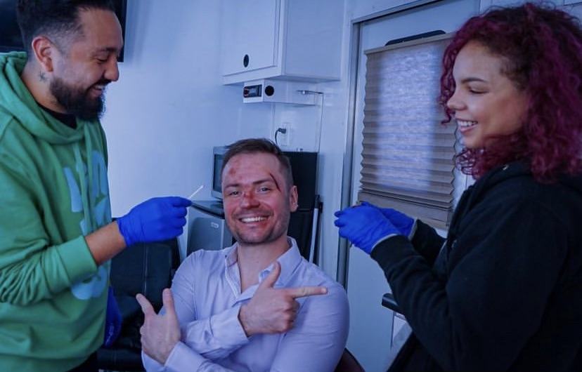 Special effects makeup, on set moment